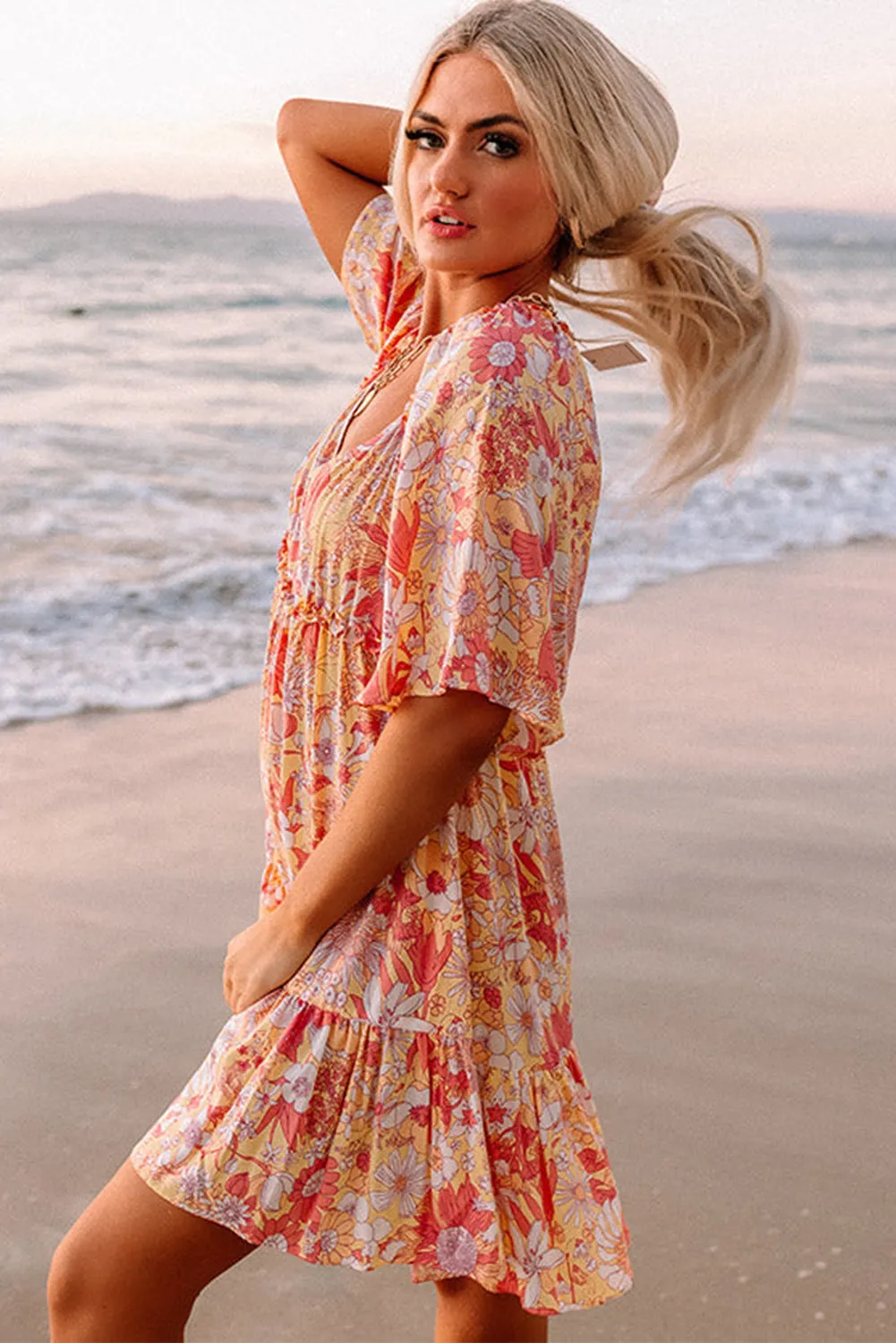 Floral Mini Dress with Flutter Sleeves and V-Neckline