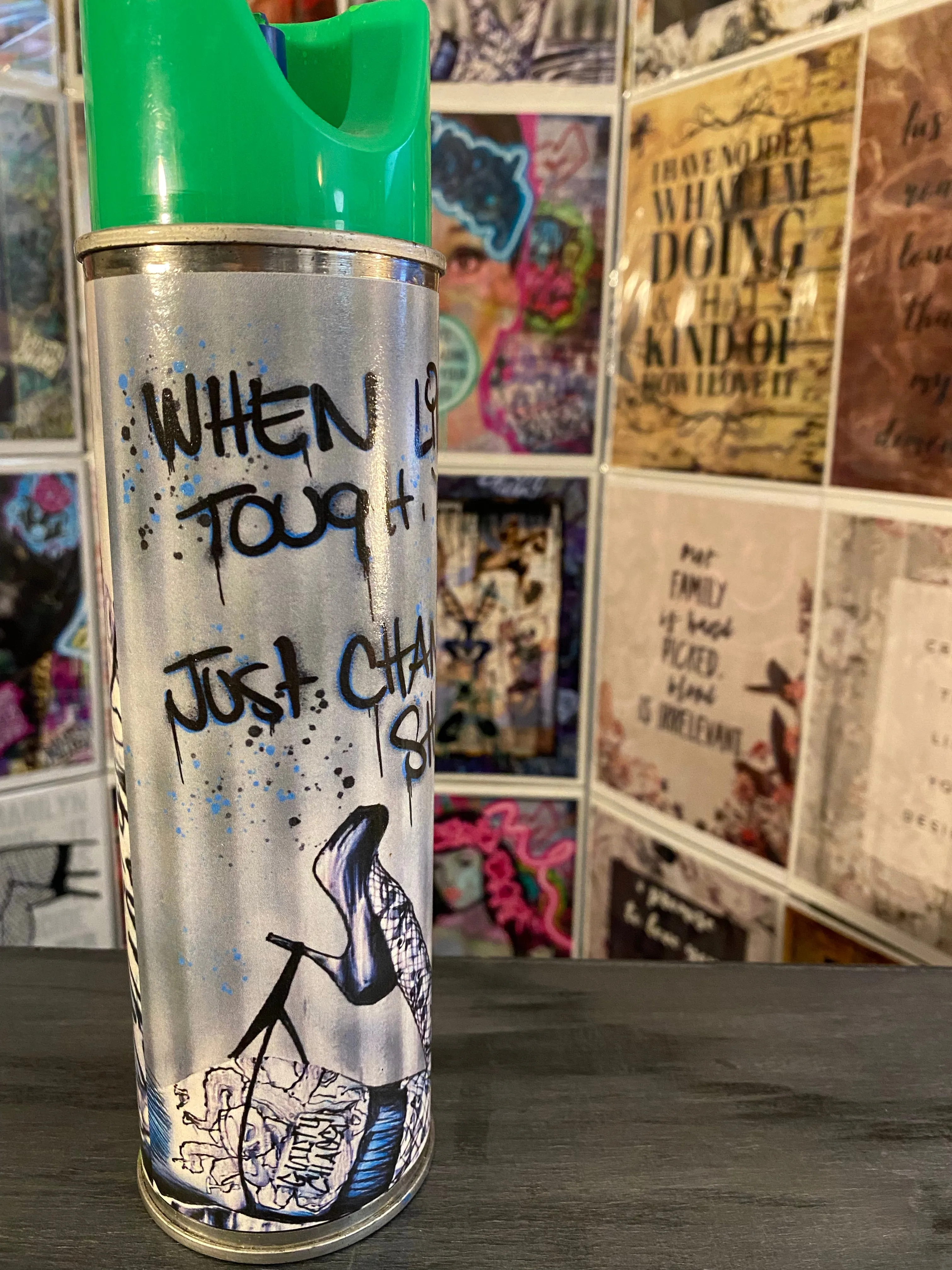 Guilty Chaos “when life gets tough, don’t quit” print covered spray can