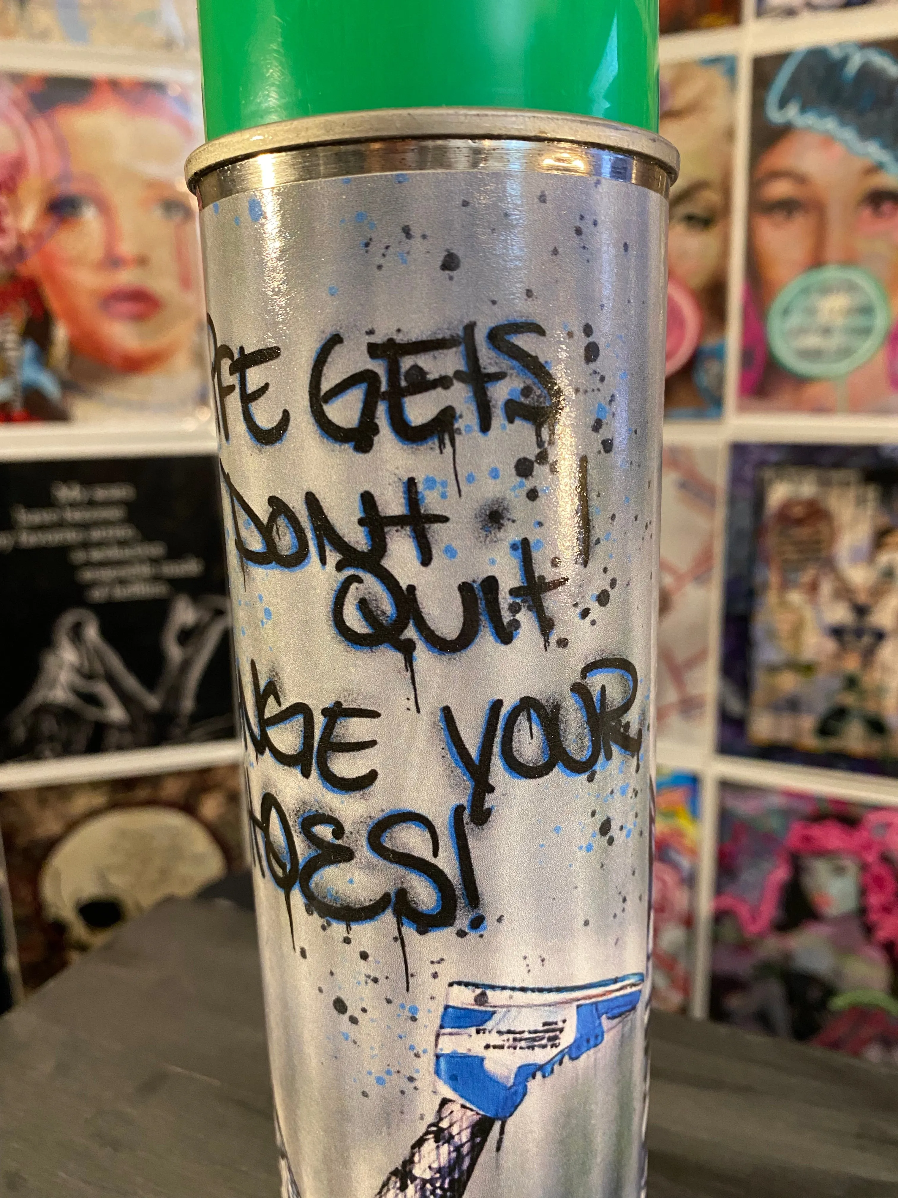 Guilty Chaos “when life gets tough, don’t quit” print covered spray can