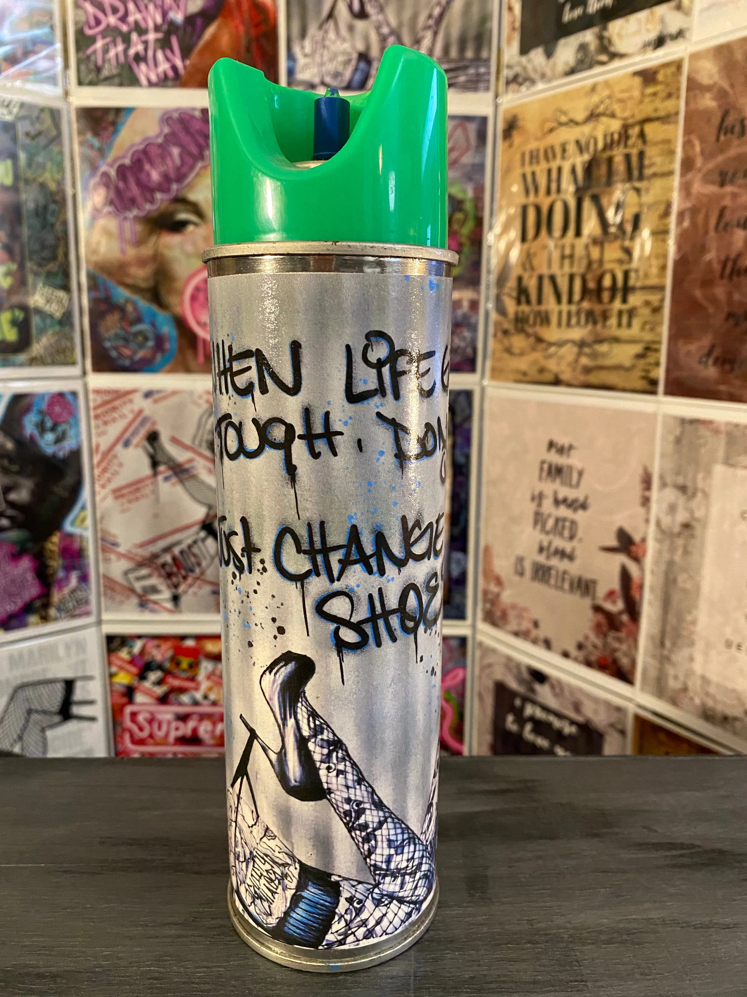 Guilty Chaos “when life gets tough, don’t quit” print covered spray can