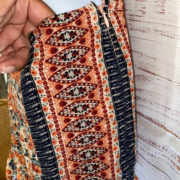 NWOT Free People Boho Surf Date Front Tie Copper Floral Cutout Romper.