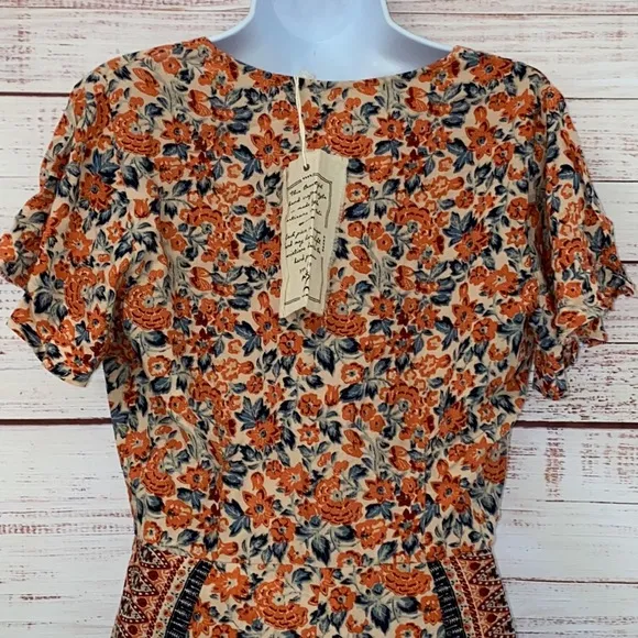 NWOT Free People Boho Surf Date Front Tie Copper Floral Cutout Romper.