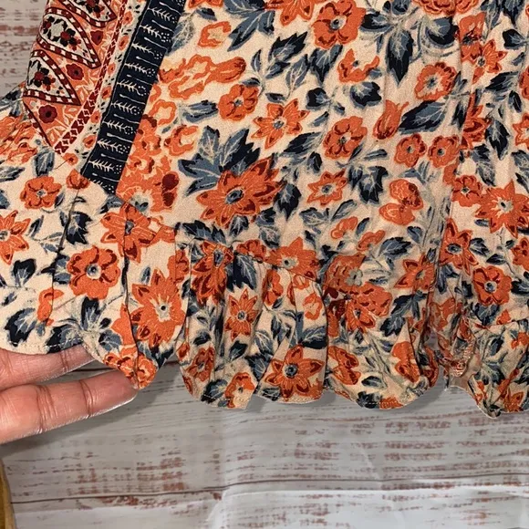 NWOT Free People Boho Surf Date Front Tie Copper Floral Cutout Romper.