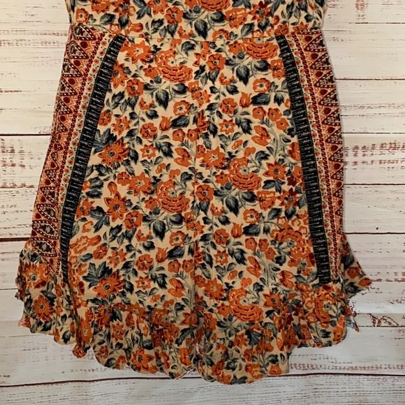 NWOT Free People Boho Surf Date Front Tie Copper Floral Cutout Romper.