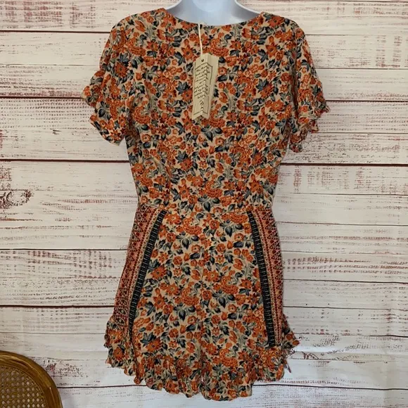 NWOT Free People Boho Surf Date Front Tie Copper Floral Cutout Romper.