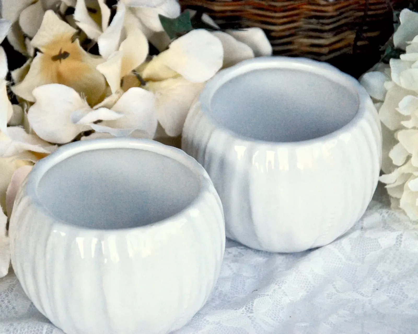 Pair of small white ceramic candle holders
