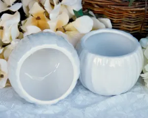 Pair of small white ceramic candle holders